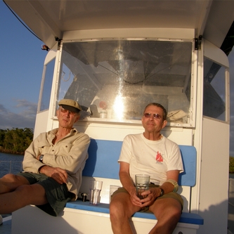 Brothers Meade and Jan Gougeon kick back and relax aboard Meade's Gougmaran.